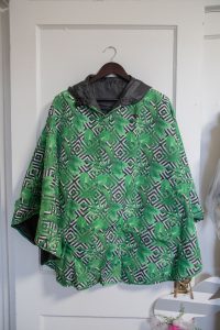 Singing in the Rain Reversible Poncho: Palm Party and Black $55.00